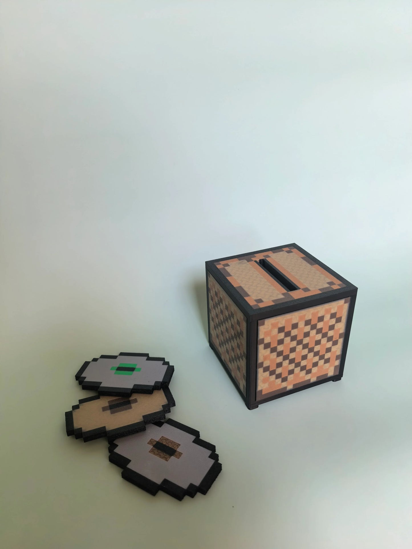 The Minecraft-themed NFC Music Box surrounded by classic blocky collectibles — bringing the legendary voxel universe to life with pixel-art sound and seamless NFC magic.