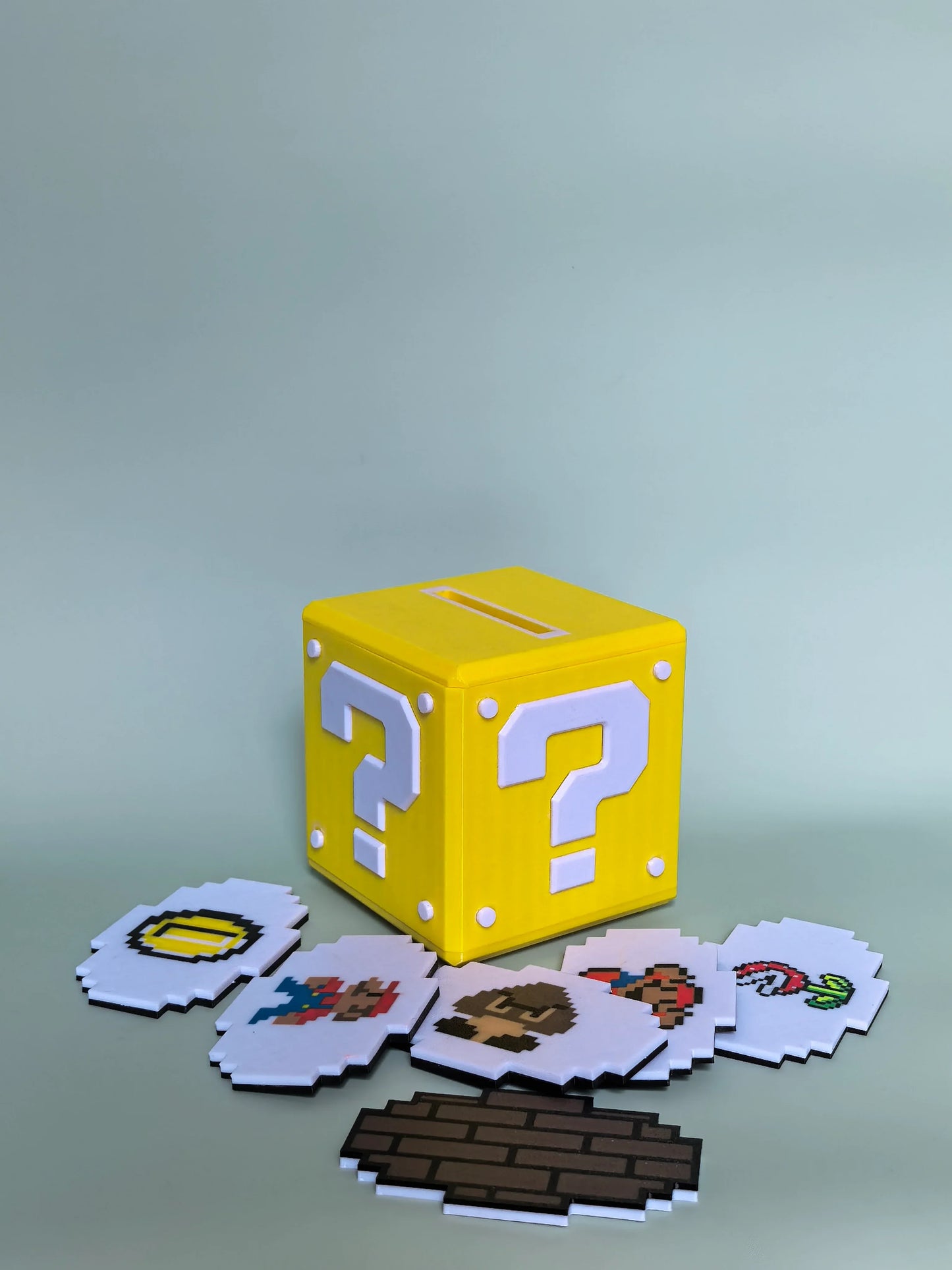 The Mario-themed NFC Music Box surrounded by classic Nintendo collectibles — bringing the legendary Super Mario universe to life with pixel-art sound and seamless NFC magic.